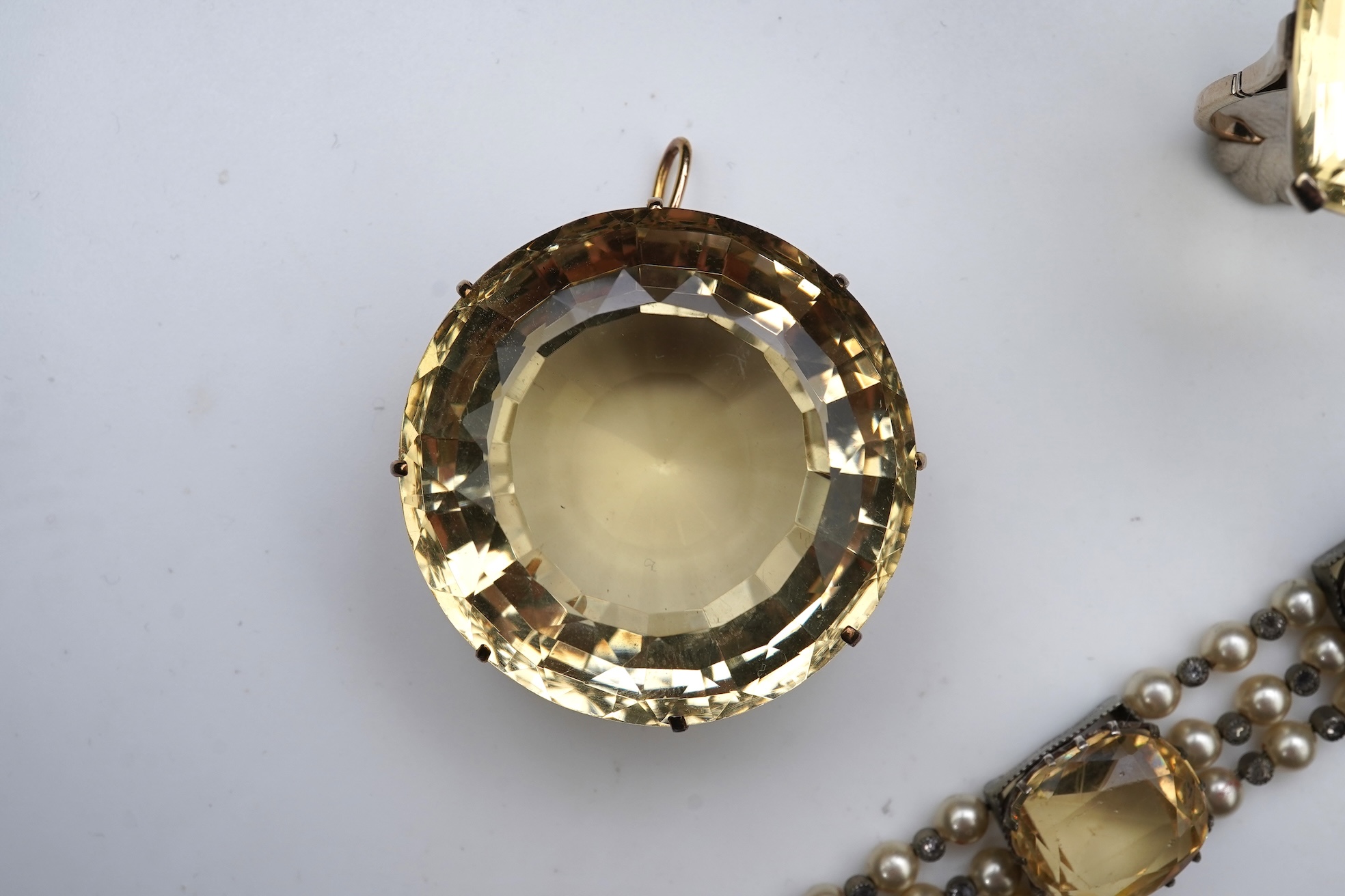 A collection of citrine jewels and a paste bracelet